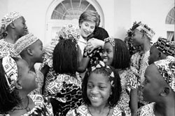 Mrs. Bush gives choir members of the Uganda Childrens Choir a tour of the White House after they gave a performance [White House photo office]