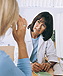 a photo of a doctor consulting with a female patient