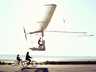 Gossamer Albatross flies over bicycles