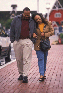 a photo of an African-American couple walking together.