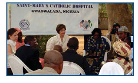 First Lady Laura Bush speaks with families living
with and affected by HIV/AIDS during her visit to
St. Mary's Catholic Hospital, Gwagwalada.