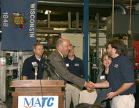 Governor Doyle presenting certificate to Nate Keurschner