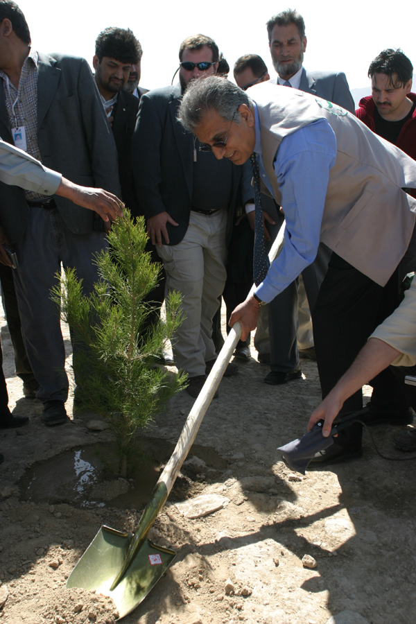 Kabul, March 20 - U.S. Ambassador to Afghanistan Zalmay Khalilzad planting a tree on Afghan New Year's Day, at the inauguration of Kabul Green Week, an initiative to educate Kabul's citizens on how to preserve and protect the environment. The United States government - through the U.S. Agency for International Development - has contributed almost $1 million towards tree planting to restore the natural beauty of Afghanistan's capital, Kabul. 