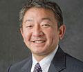 photo: head shot of smiling man in suit