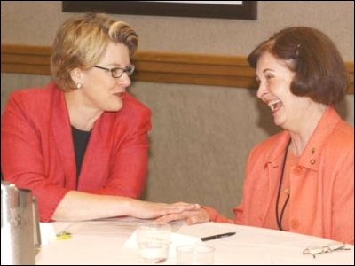 Secretary Spellings talks with Beth Hoff, a teacher at Overland Trail Middle School in Overland Park, Kansas.  Ms. Hoff made presentations (with her colleague Greg Murphy) on linear equations at the Teacher-to-Teacher Summer Workshops hosted by ED. 