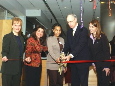 Deputy Secretary Ray Simon and a student artist at SEED Charter Public School, Washington, D.C., cut the ribbon of the international student art and writing exhibit at the opening ceremony of International Education Week at ED.  Others in the photo (left to right) are Shana Dale, deputy administrator, NASA; Soula Antoniou, president, VSA arts; and Sarah Gesiriech, director, ED International Affairs Office.