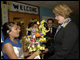 Secretary Spellings accepts flowers from a student at Webb Middle School in Austin, Texas.