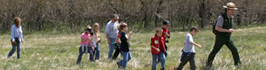 A park ranger leads a group of students through Shenandoah's Big Meadows.