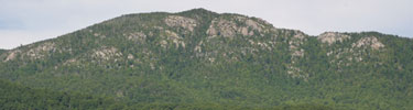 Old Rag Mountain's ancient granite with summer foilage as viewed from the east.