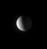 The high northern latitudes on Enceladus show little detail from Cassini's distant vantage point, nearly 50 degrees above the moon's equator