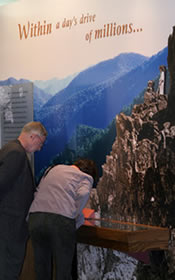 Two Shenandoah visitors learn about the creation of Shenandoah National Park while viewing the exhibit at Byrd Visitor Center.