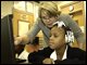 Secretary Spellings talks with a student at F.L. Stanton Elementary School in Atlanta, Georgia.