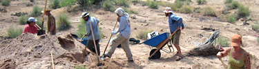 Archeologists working at a site in the canyon.