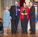 Photo of Jay and Linda Foley from the Identity Theft Resource Center (San Diego, CA); they are accompanied by Deborah Daniels and John Ashcroft.