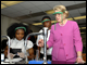 Secretary Spellings does an experiment with chemistry students at Banneker High School.