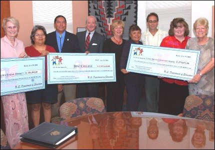 Deputy Secretary of Education Gene Hickok presents grant awards to local representatives from Page Unified School, Little Singer Community School and Dine College during an event at Northern Arizona University in Flagstaff, Ariz.