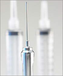 photo of a needle and syringes