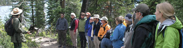 visitors attending a guided interpretive walk to Inspiration Point