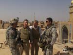 Congressman Lynch and Congressman Platts stand with soldiers across from the Golden Mosque in Samarra.