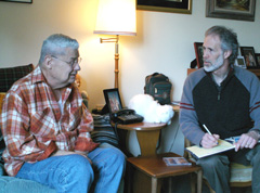 Chuck Lazenby (left) of Seattle talks with Carl Kaiser, a counselor in the Program to Encourage Active, Rewarding Lives for Seniors (PEARLS). Click to enlarge.