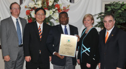 Picture of Warren Dixon receiving his award.