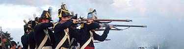 The Fort McHenry Guard fires a volley during the Defenders Day program.