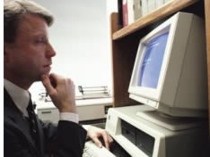 Image of a man in front of computer, representing how the public can comment online on EPA's regulations.