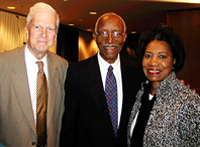 Historian John Hope Franklin, center, celebrates the completion of his autobiography, "Mirror to America," which he wrote largely at the Library's John Kluge Center. Greeting him at a program sponsored by the Kluge Center and the Center for the Book were Librarian of Congress James Billington and Rep. Juanita Millender-McDonald (D-Calif.), the ranking member for the Committee on House Administration and a member of the Joint Committee on the Library.