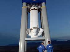 Technicians inspect a full-scale inert abort motor and test stand at an ATK facility in Promontory, Utah.