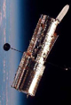Image of the Hubble floating in space, oriented vertically