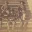 prisoners sitting in chairs on the steps of the courthouse