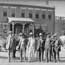 detail of deputy marshals in front of courthouse building