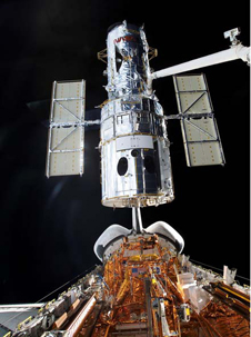 image of the hubble attached to the space shuttle