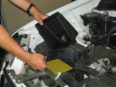 Mechanic performing vehicle maintenance