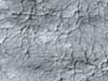 A delicate pattern, like that of a spider web, appears on top of the Mars residual polar cap.
