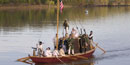 reproduction of keelboat on Arkansas River with first fort soldier reenactors