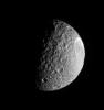 Mimas plows along in its orbit, its pockmarked surface in crisp relief. The bright, steep walls of the enormous crater, Herschel (130 kilometers, or 80 miles wide), gleam in the sunlight