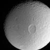 This dramatic close-up of Tethys shows the large crater Penelope lying 
near center, overprinted by many smaller, younger impact sites