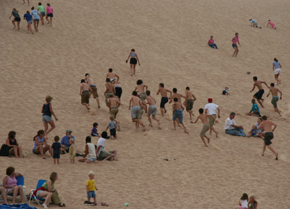 People climbing the sand dunes at the Dune Climb