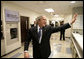 President George W. Bush waves goodbye to staff members following his tour at the Saint Luke’s-Lee’s Summit hospital in Lee’s Summit, Mo., Thursday, Jan 25, 2007, where President Bush also participated in a roundtable discussion on health care initiatives. White House photo by Eric Draper