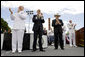 Vice President Dick Cheney is joined by Admiral Thad Allen, Commandant of the U.S. Coast Guard, left, and Secretary Michael Chertoff of Homeland Security, center, in applauding the graduates of the U.S. Coast Guard Academy, Wednesday, May 21, 2008, during commencement exercises in New London, Conn. White House photo by David Bohrer