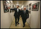 Vice President Dick Cheney and Georgian President Mikheil Saakashvili look at photographs adorning the hallways of the presidential complex Thursday, Sept. 4, 2008, in Tbilisi. White House photo by David Bohrer