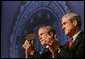 President George W. Bush and FBI Director Robert Mueller applaud the class speaker Thursday, Oct. 30, 2008, at the graduation ceremomy for FBI special agents in Quantico, Va. President Bush addressed the graduates and thanked them for stepping forward to serve their country. White House photo by Joyce N. Boghosian