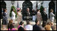 President George W. Bush stands for the national anthem with recipients of the President's Volunteer Service Award during Military Spouse Day ceremonies Tuesday, May 6, 2008, on the South Lawn of the White House. White House photo by Chris Greenberg