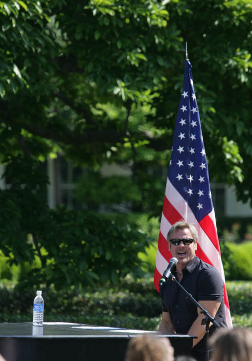 Country recording artist Phil Vassar sings the national anthem Tuesday, May 6, 2008, during Military Spouse Day celebration on the South Lawn of the White House. White House photo by Chris Greenberg