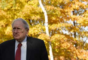 Photo of Senator Levin in front of trees with beautiful fall foliage.