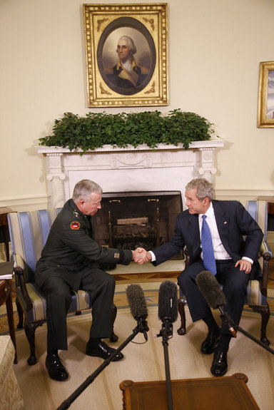 President George W. Bush welcomes General David D. McKiernan, Commander for NATO International Security Assistance Force in Afghanistan, to the Oval Office Wednesday, Oct. 1, 2008. White House photo by Eric Draper