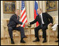 President George W. Bush and Russia's President Vladimir Putin shake hands before their G8 bilateral meeting Saturday, July 15, 2006, at the Konstantinovsky Palace Complex in Strelna, Russia.  White House photo by Eric Draper