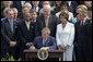 President George W. Bush signs H.R. 9, the Fannie Lou Hamer, Rosa Parks, and Coretta Scott King Voting Rights Act Reauthorization and Amendments Act of 2006, on the South Lawn Thursday, July 27, 2006.  White House photo by Paul Morse