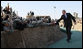 President George W. Bush reaches out to troops at Camp Arifjan in Kuwait Saturday, Jan. 12, 2008, during his last stop in the country before continuing on to Bahrain. White House photo by Eric Draper